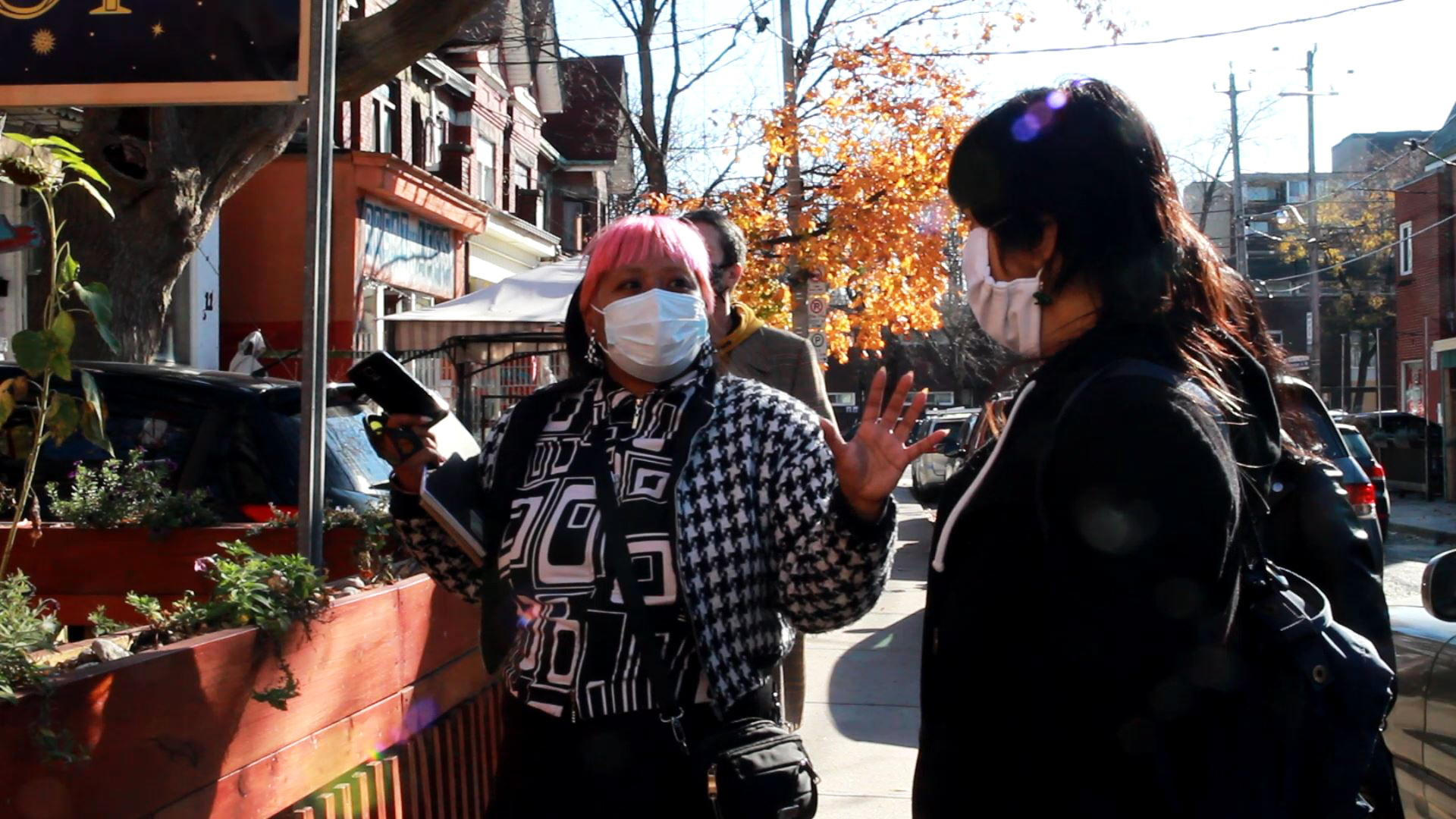 Artists exploring Kensington market iin preparation for their projects